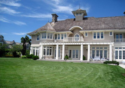 backyard view of exterior house painting of mansion