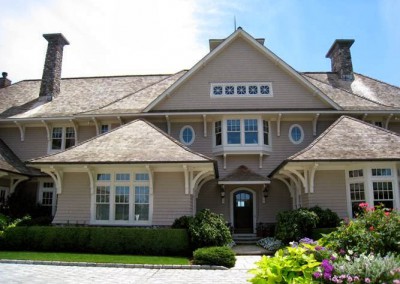 front of mansion with exterior wood siding